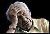 old man resting his forehead on his hand like he's got a headache after working that he owes a million dollars back taxes